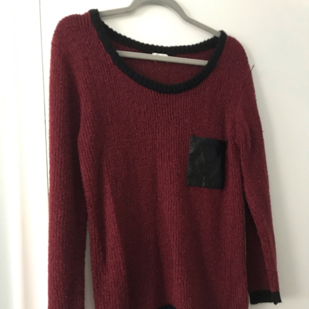 Unique red sweater with leather pocket